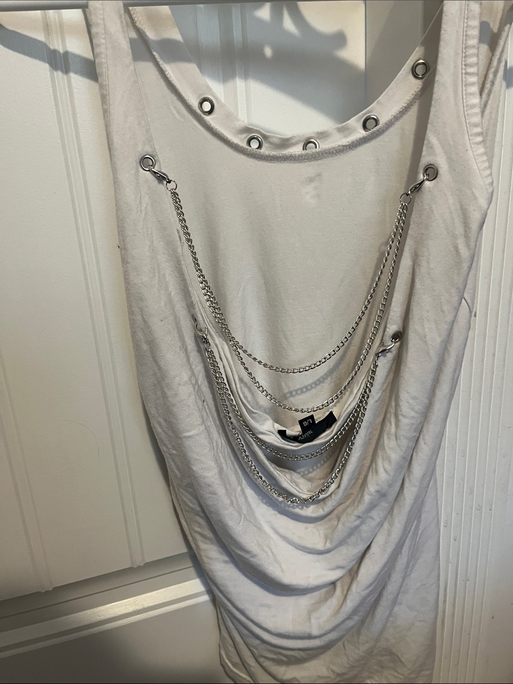 White open back with chain aesthetic and gorgeous blue design on the front.